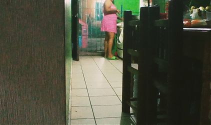 chubby mexican wife preparing dinner in the kitchen