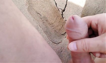 stepfather looks at his naked stepdaughter on the beach and plays with his cock at the sight of her.